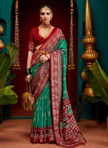 Patola Silk Trendy Saree in Green Enhanced with Pr